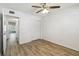Bedroom featuring wood-look floors and a large closet at 2310 Denmark St # 34, Clearwater, FL 33763
