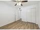 Bedroom featuring wood-look floors and a large closet at 2310 Denmark St # 34, Clearwater, FL 33763