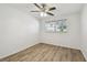 Bedroom featuring wood-look floors and a large window at 2310 Denmark St # 34, Clearwater, FL 33763
