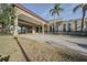 Attractive building entrance with a covered portico and lush landscaping at 2310 Denmark St # 34, Clearwater, FL 33763
