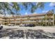 Low-rise apartment building featuring a classic facade and ample parking at 2310 Denmark St # 34, Clearwater, FL 33763