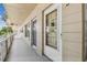 Exterior view of a condo entrance, showing the walkway, and door to the unit at 2310 Denmark St # 34, Clearwater, FL 33763