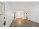 Bright living room with stylish flooring and a view into other rooms, creating an inviting and open space at 2310 Denmark St # 34, Clearwater, FL 33763