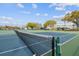 Well-maintained tennis courts ready for play, set against a backdrop of community buildings at 2310 Denmark St # 34, Clearwater, FL 33763
