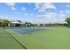 Outdoor tennis courts surrounded by lush landscaping providing a great recreational amenity at 2310 Denmark St # 34, Clearwater, FL 33763