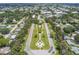 This aerial view of the neighborhood highlights manicured lawns and mature trees at 2311 Brisbane St # 45, Clearwater, FL 33763