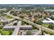An aerial shot showing the neighborhood with a community of well-maintained residences and lush greenery at 2311 Brisbane St # 45, Clearwater, FL 33763