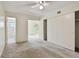 Bright bedroom with neutral carpet, ceiling fan, large closet, and ensuite bathroom at 2311 Brisbane St # 45, Clearwater, FL 33763
