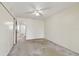 Neutral bedroom featuring neutral carpet and a ceiling fan with a light fixture at 2311 Brisbane St # 45, Clearwater, FL 33763