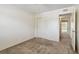 Bright bedroom featuring neutral carpet, a ceiling fan, and a double door closet at 2311 Brisbane St # 45, Clearwater, FL 33763