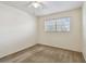 Bedroom featuring neutral carpet, a ceiling fan, and a window with blinds at 2311 Brisbane St # 45, Clearwater, FL 33763