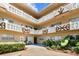 Exterior view of a beige courtyard and walkways of a condo building at 2311 Brisbane St # 45, Clearwater, FL 33763