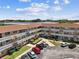 A condo showcasing clean architecture and a well-manicured courtyard with parking at 2311 Brisbane St # 45, Clearwater, FL 33763