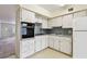 This well-maintained kitchen includes a built-in oven and a refrigerator at 2311 Brisbane St # 45, Clearwater, FL 33763