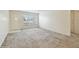 Bright living room with large window and carpeted floors at 2311 Brisbane St # 45, Clearwater, FL 33763