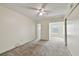 A spacious bedroom with lots of natural light and a ceiling fan at 2311 Brisbane St # 45, Clearwater, FL 33763