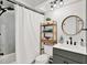 Bathroom area complete with shower, vanity, mirror and hanging lights at 2454 Shadecrest Rd, Land O Lakes, FL 34639