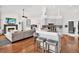 Open-concept kitchen featuring light gray cabinets, modern appliances, and a breakfast bar with seating at 2454 Shadecrest Rd, Land O Lakes, FL 34639