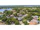 An aerial view showcases lush landscapes and the luxurious neighborhood near the serene lake, defining upscale living at 2819 Safe Harbor Dr, Tampa, FL 33618