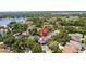 An aerial view pinpoints a luxury home nestled among lush landscapes and a tranquil lake, emphasizing upscale living at 2819 Safe Harbor Dr, Tampa, FL 33618