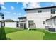 Spacious backyard featuring a putting green, play area, and well-maintained lawn at 2819 Safe Harbor Dr, Tampa, FL 33618