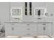 Bright bathroom featuring double vanity and illuminated mirror at 2819 Safe Harbor Dr, Tampa, FL 33618