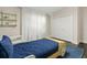 Charming bedroom with wood car bed, white trim, hardwood floors, shelving and white curtains at 2819 Safe Harbor Dr, Tampa, FL 33618