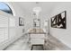 Dining room with a long table, marble floors, chandelier, and neutral paint at 2819 Safe Harbor Dr, Tampa, FL 33618