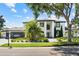 Stunning two-story home boasts a modern design, lush landscaping, and a brick driveway at 2819 Safe Harbor Dr, Tampa, FL 33618