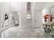 Bright and spacious foyer with marble floors, a staircase, and elegant decor elements at 2819 Safe Harbor Dr, Tampa, FL 33618