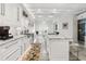 Bright kitchen with an island, marble countertops, stainless steel appliances, and wooden floors at 2819 Safe Harbor Dr, Tampa, FL 33618