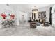 Sophisticated living room with marble flooring, stylish seating, and modern art accents at 2819 Safe Harbor Dr, Tampa, FL 33618