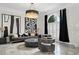 Inviting living room showcases stunning marble floors, stylish furniture, and chic black and white accents at 2819 Safe Harbor Dr, Tampa, FL 33618