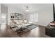 Open living room design with hardwood floors, shuttered windows, and cozy decor at 2819 Safe Harbor Dr, Tampa, FL 33618