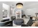 Spacious living area with marble floors, modern seating, and an open floor plan at 2819 Safe Harbor Dr, Tampa, FL 33618