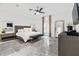 Spacious main bedroom with marble floors, modern furnishings, and ample natural light at 2819 Safe Harbor Dr, Tampa, FL 33618