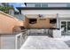 Fully equipped outdoor kitchen with stainless steel appliances and bar seating for entertaining guests at 2819 Safe Harbor Dr, Tampa, FL 33618