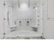 A luxurious shower with dual shower heads and built in benches at 2819 Safe Harbor Dr, Tampa, FL 33618