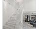 Elegant white staircase leading to a beautifully decorated living area at 2819 Safe Harbor Dr, Tampa, FL 33618