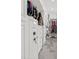 A beautifully designed walk-in closet with custom storage and a high-end safe at 2819 Safe Harbor Dr, Tampa, FL 33618