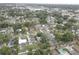 A high angle shot of a residential neighborhood with mature trees, landscaped yards, and various home styles in a suburban setting at 3212 34Th N Ave, St Petersburg, FL 33713