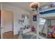 Bright bedroom featuring a loft bed, fun decor, and a circular area rug over wood flooring at 3212 34Th N Ave, St Petersburg, FL 33713