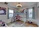 Playful bedroom with a loft bed over a desk, plenty of space, and playful decor at 3212 34Th N Ave, St Petersburg, FL 33713