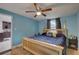 Bedroom with wood floors and ceiling fan next to the fully equipped kitchen at 3212 34Th N Ave, St Petersburg, FL 33713