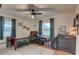 Comfortable bedroom with a wood frame bed, desk, and dresser with plenty of natural light at 3212 34Th N Ave, St Petersburg, FL 33713