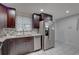 Updated kitchen with granite countertops, stainless steel appliances, and tiled backsplash at 3212 34Th N Ave, St Petersburg, FL 33713