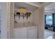 Functional laundry closet complete with a washer, dryer, shelving, and easy access to the rest of the home at 3212 34Th N Ave, St Petersburg, FL 33713