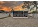 This home features a screened-in porch and a paved backyard, offering a great outdoor living space for relaxation and entertainment at 3212 34Th N Ave, St Petersburg, FL 33713