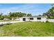 Well-maintained single-story home with lush green lawn at 3381 19Th Sw Pl, Largo, FL 33774