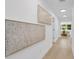 Inviting hallway featuring modern artwork and wood flooring at 3381 19Th Sw Pl, Largo, FL 33774